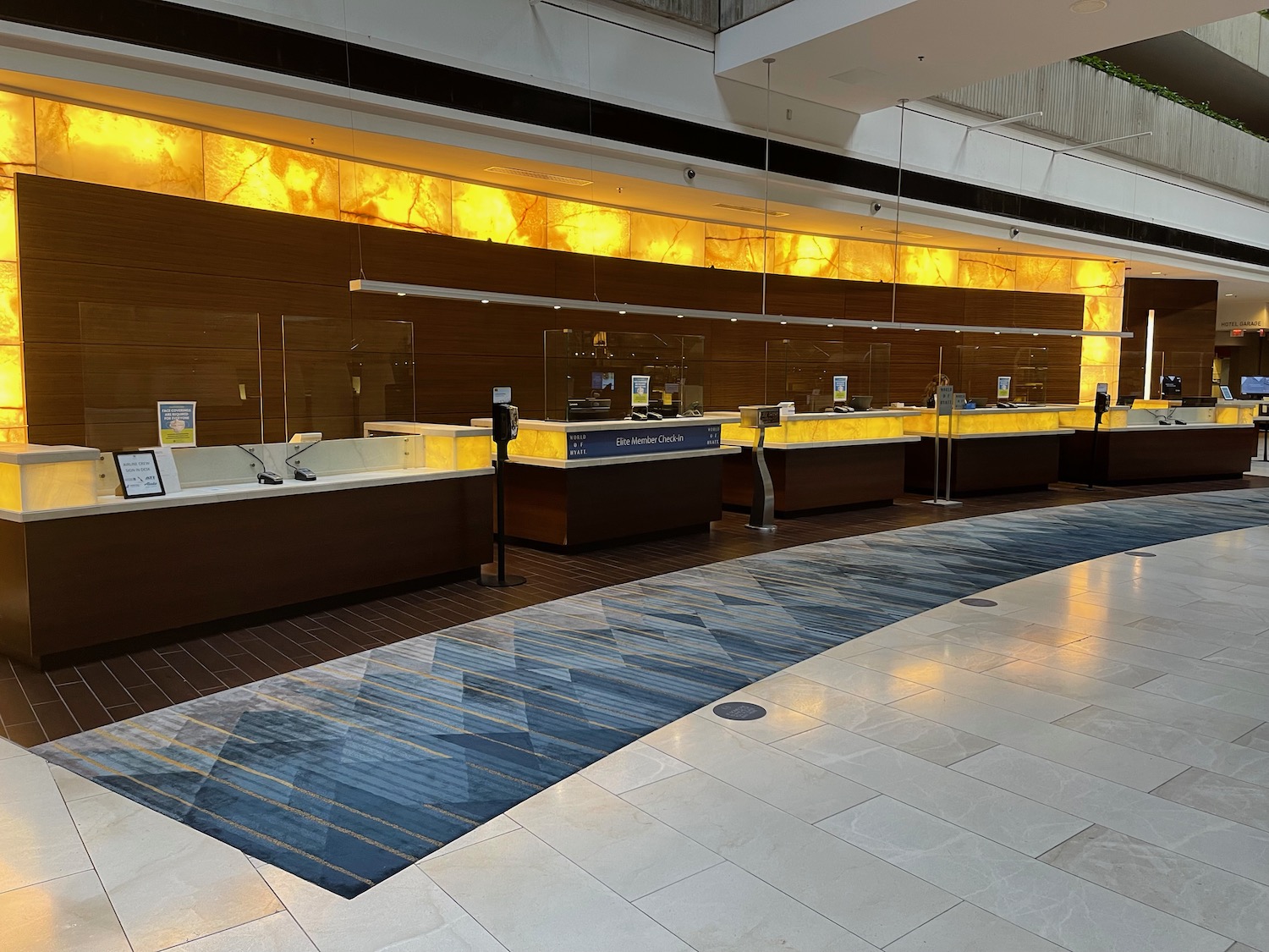 a lobby with a glass wall and a counter