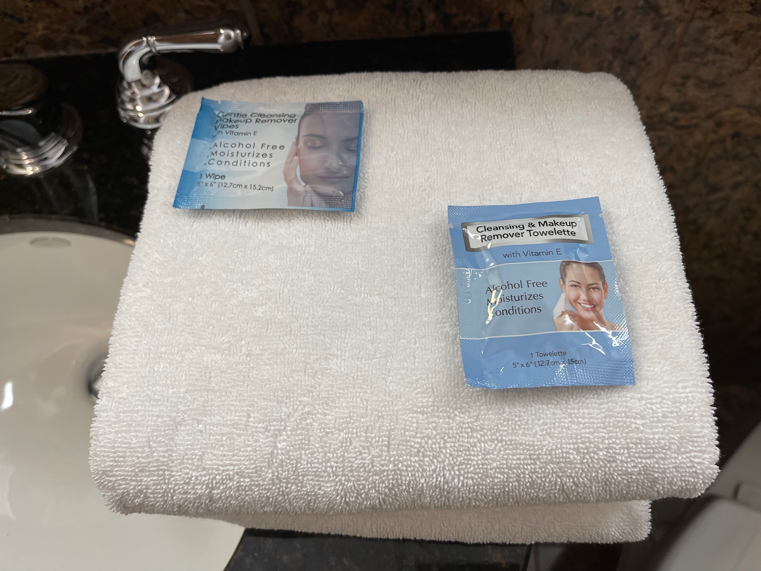 a white towel with blue packages on it