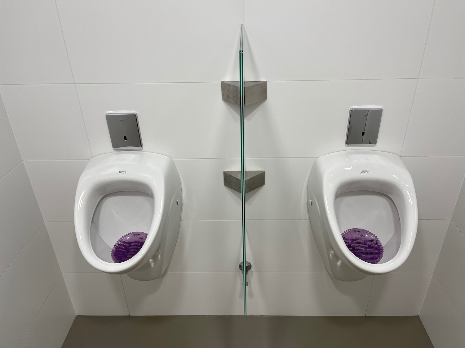 a two urinals in a bathroom