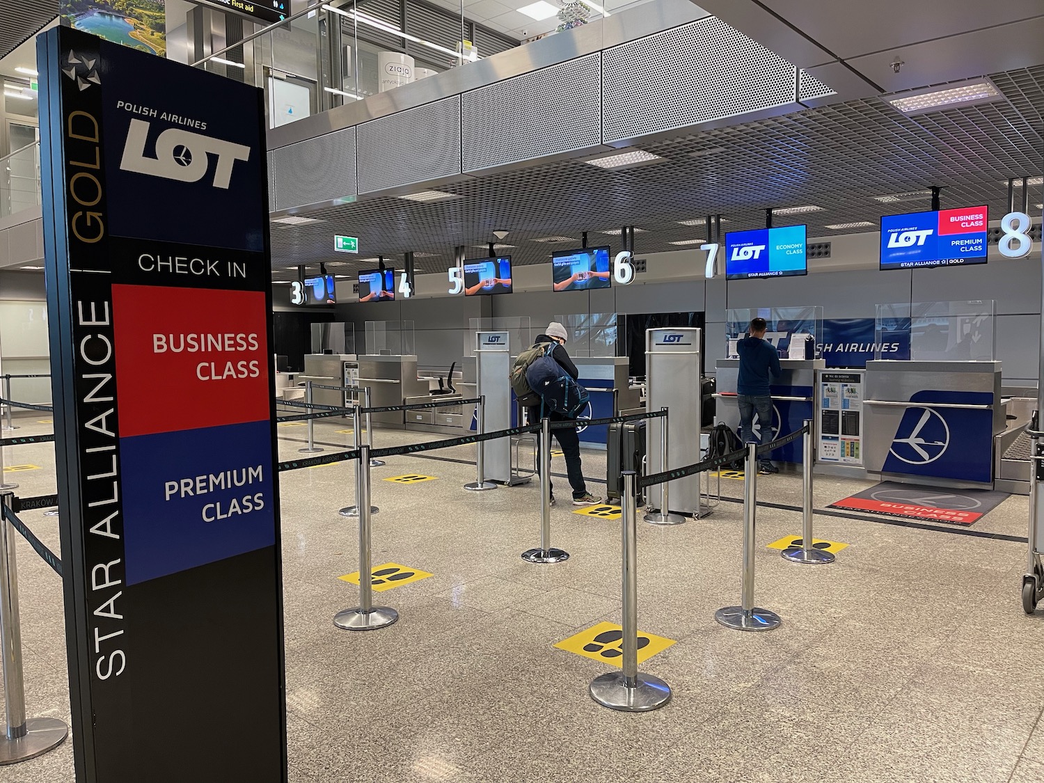 people standing in a line at an airport