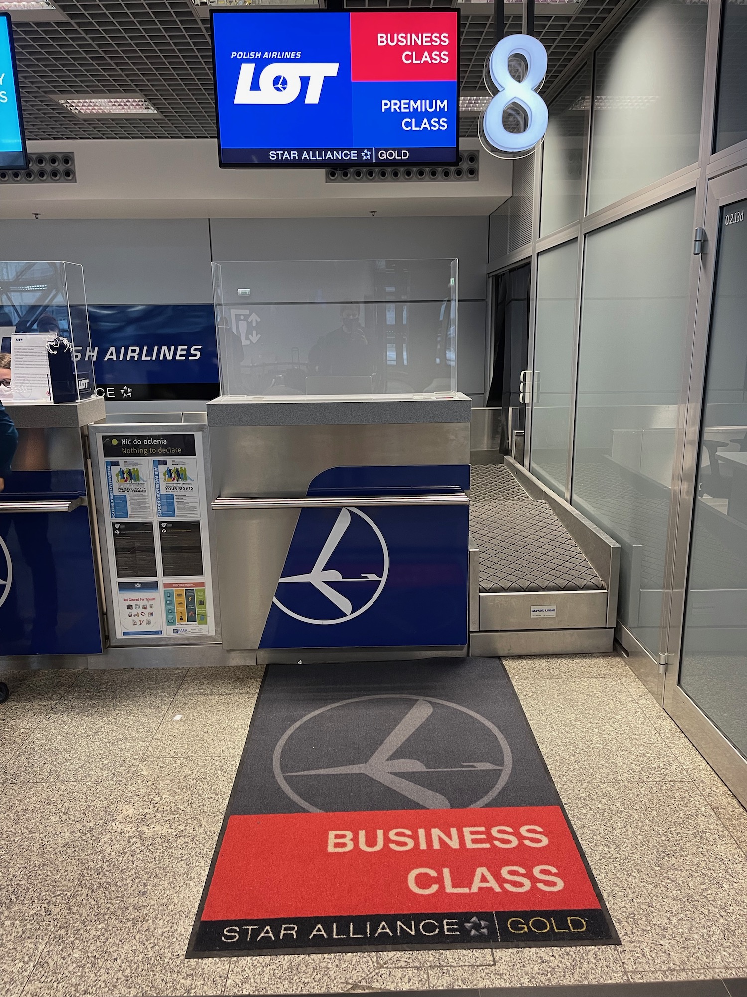 a man standing in front of a check-in counter