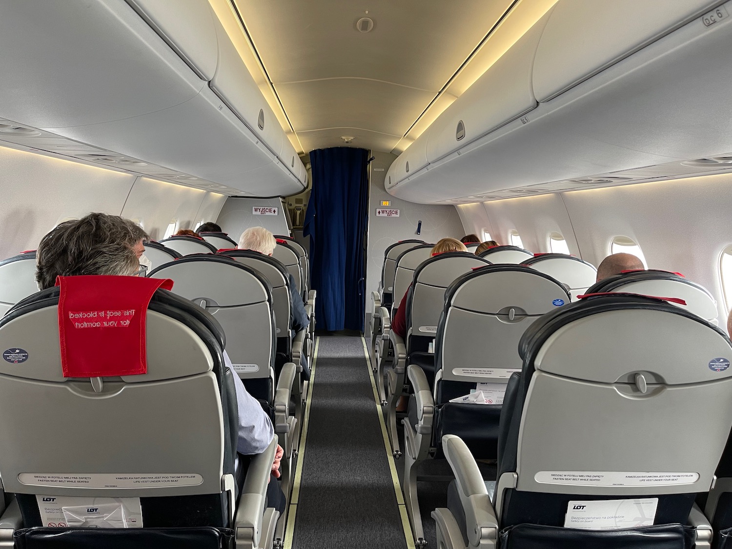 a group of people sitting in an airplane