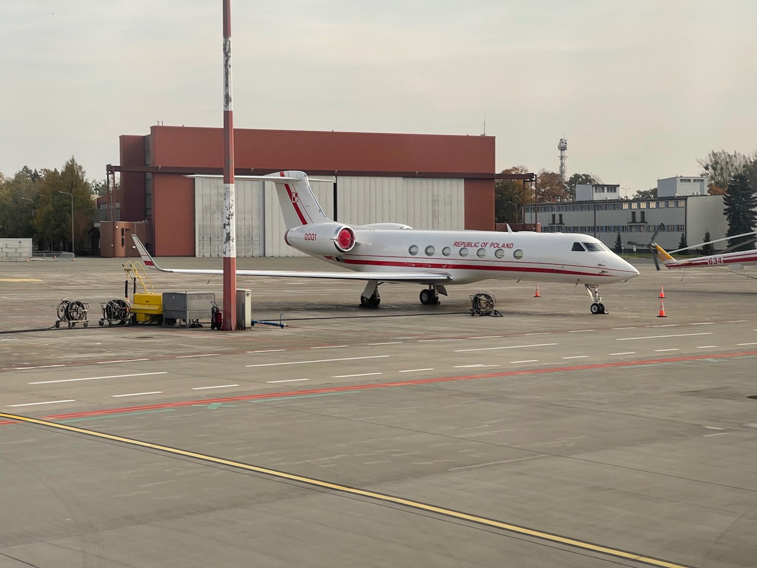 a white airplane on a runway