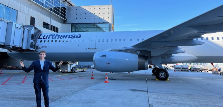 a man standing in front of an airplane