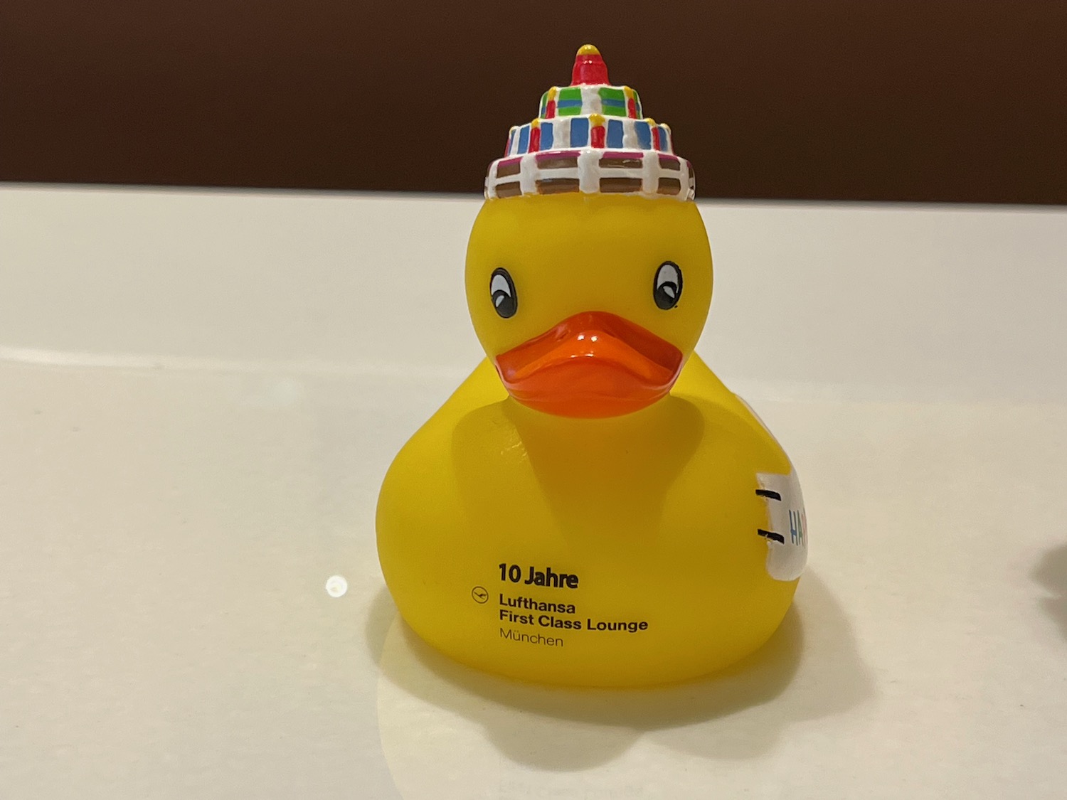 a yellow rubber duck with a hat on