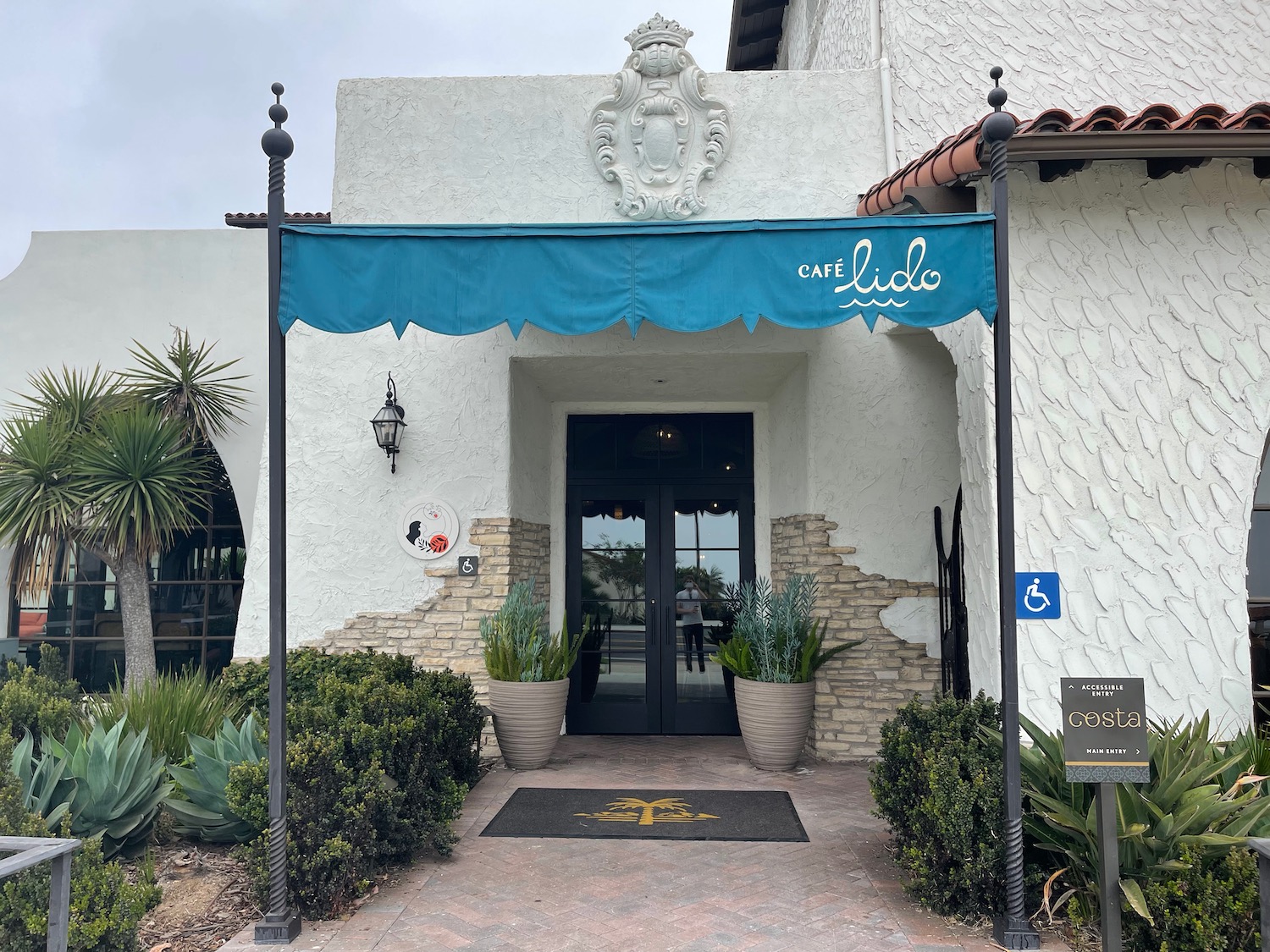 a blue awning over a white building