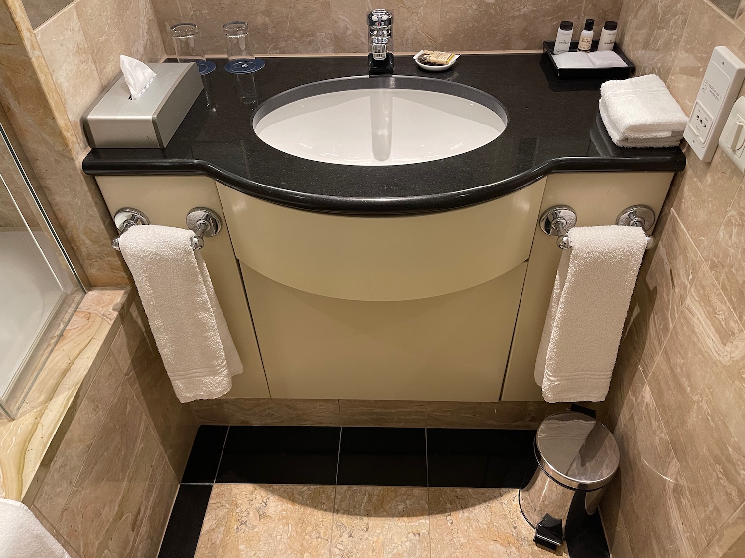 a bathroom with a sink and towels