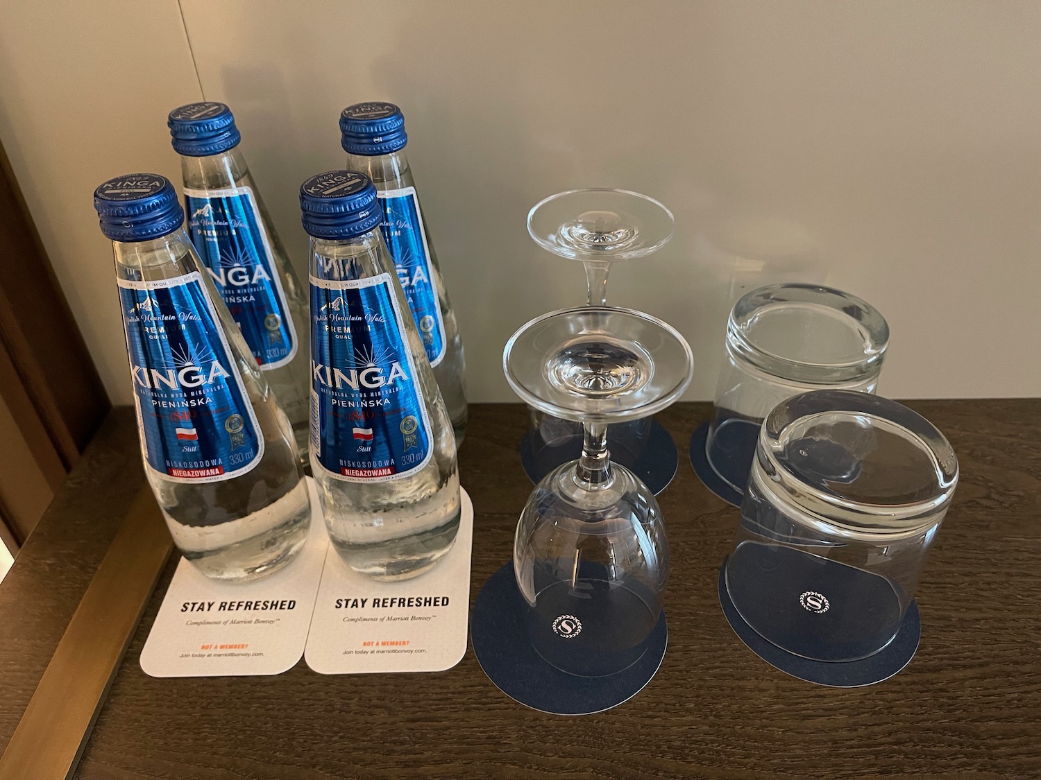 a group of empty glasses and bottles on a table