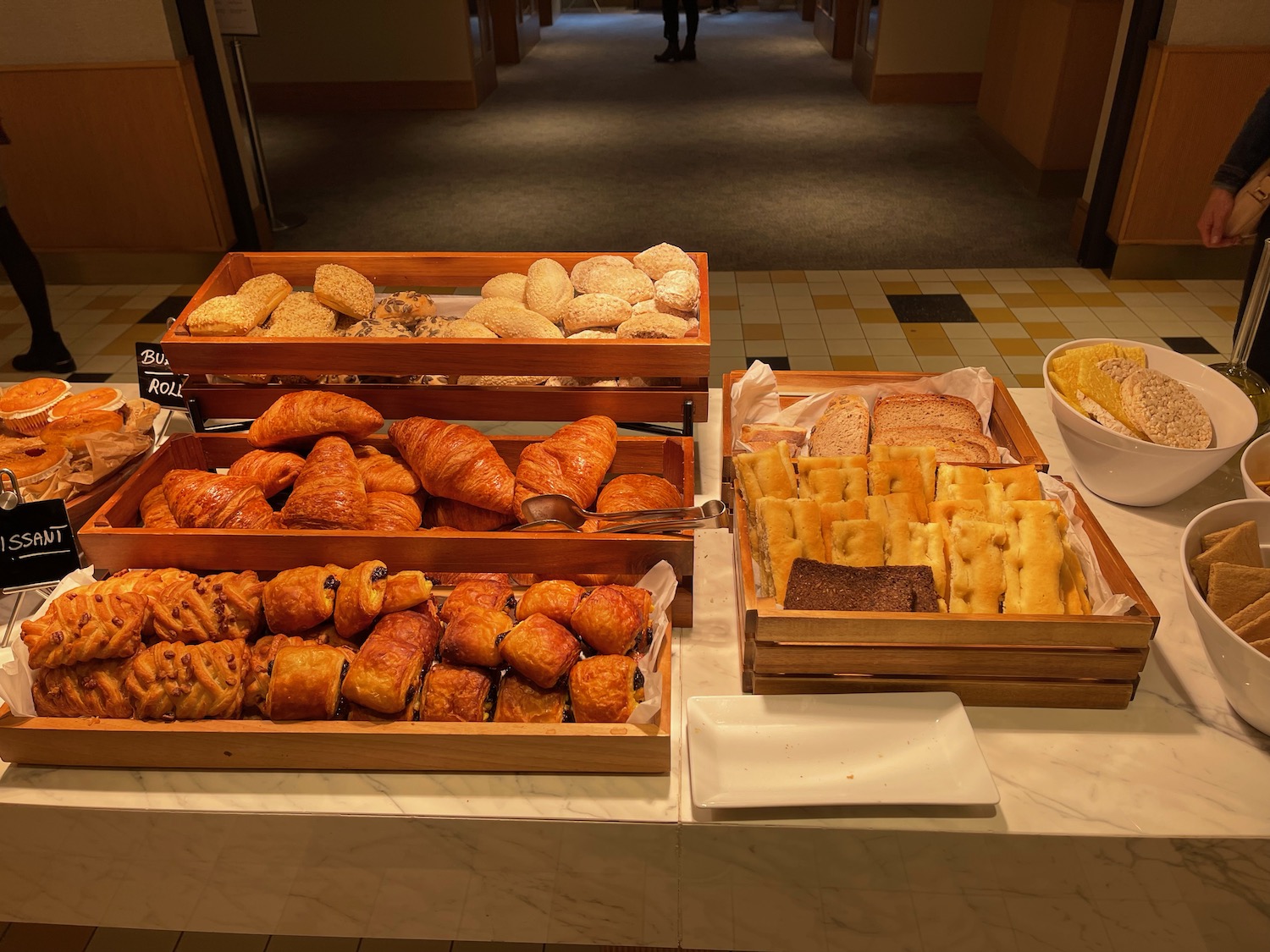 a trays of pastries and bread on a table
