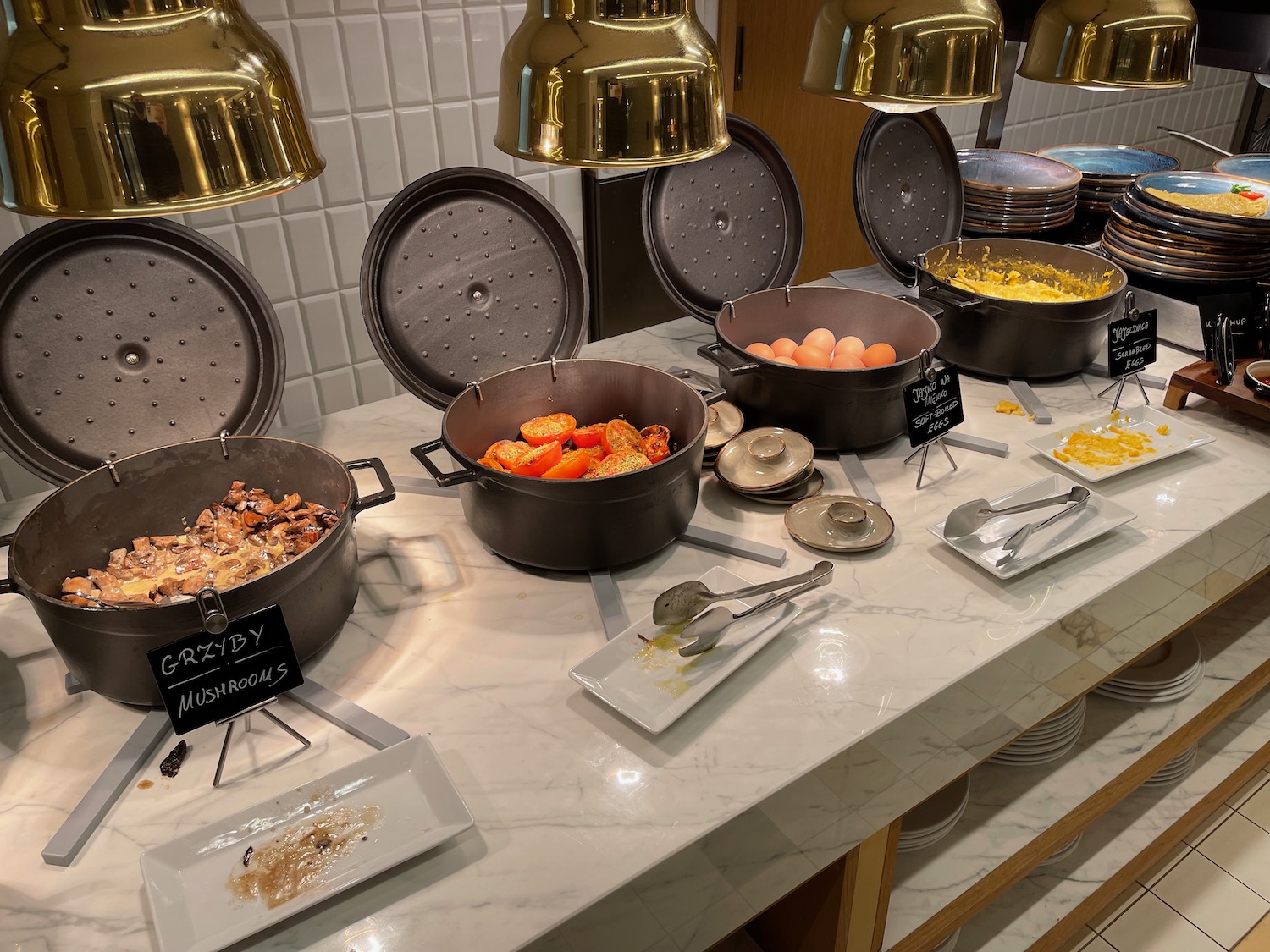 a buffet table with pots of food