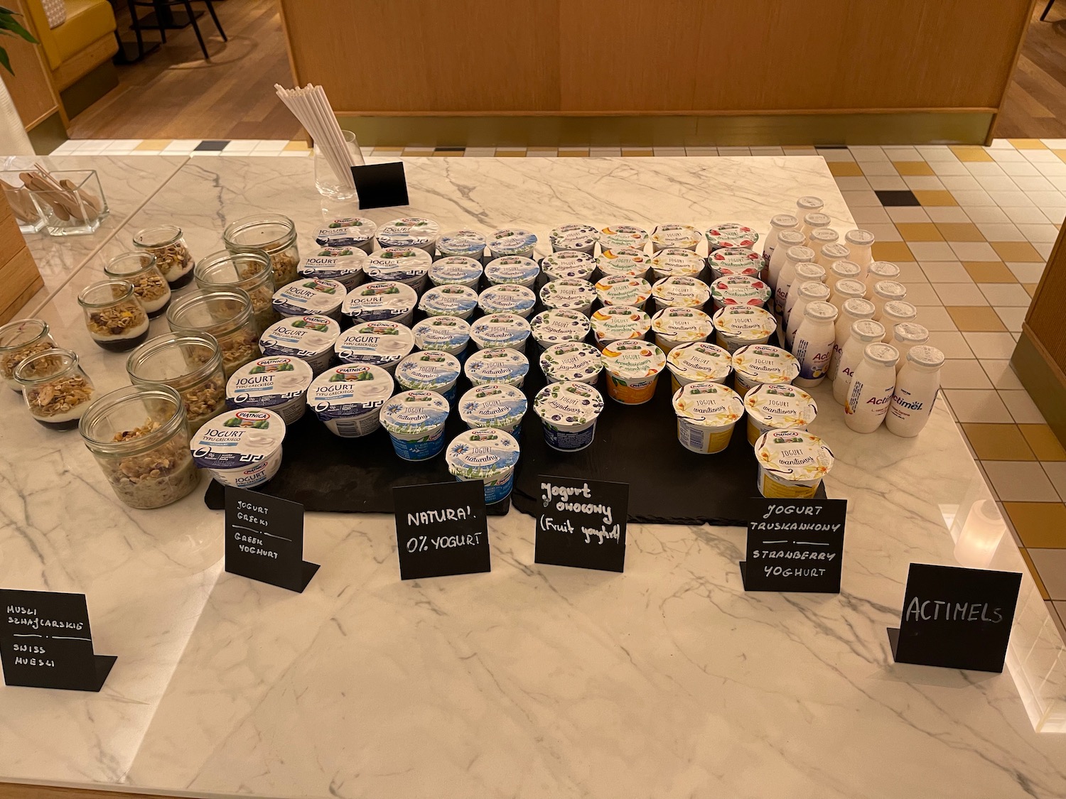 a table with different containers of yogurt and other food items