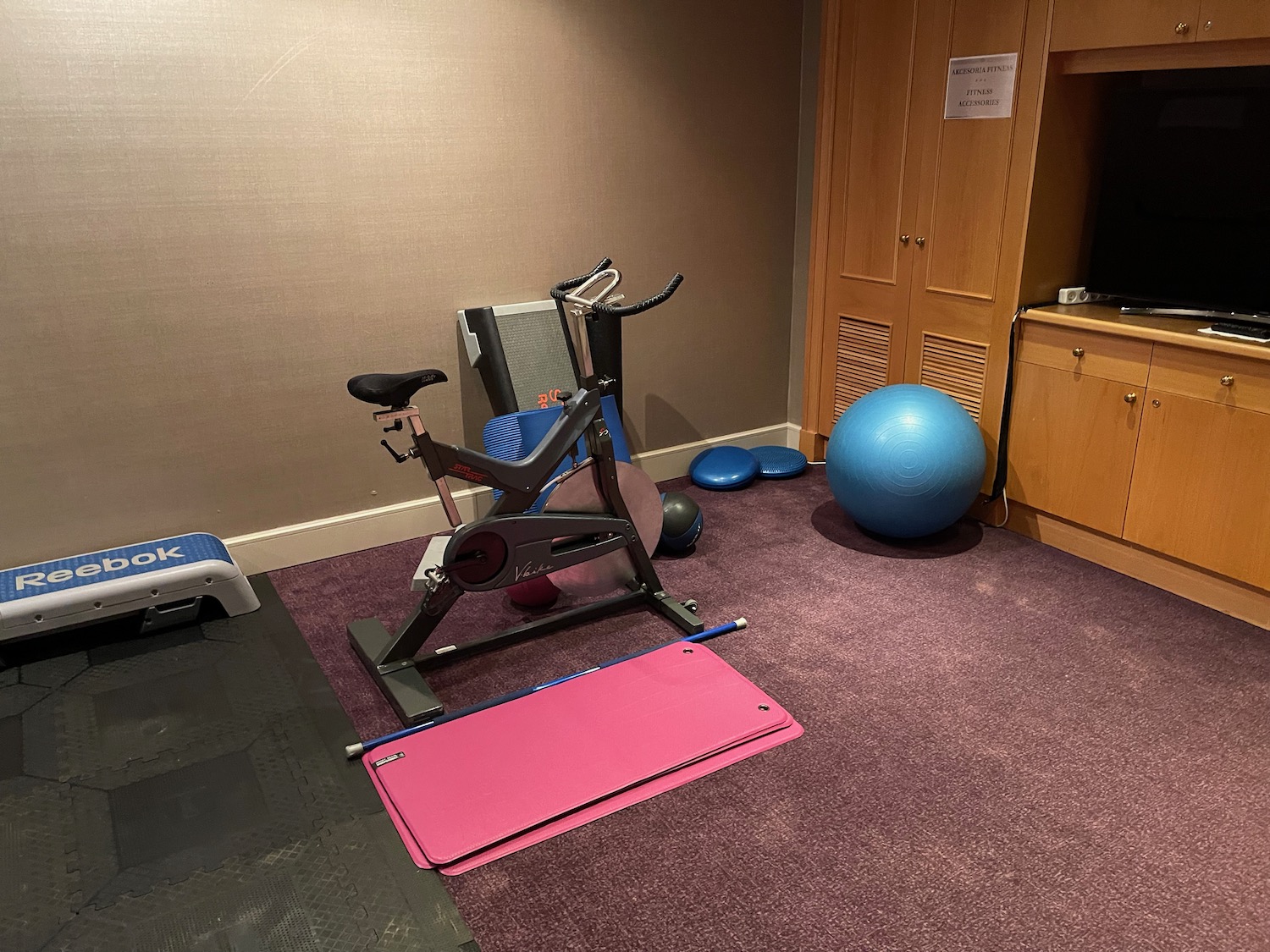 a exercise bike and exercise ball in a room