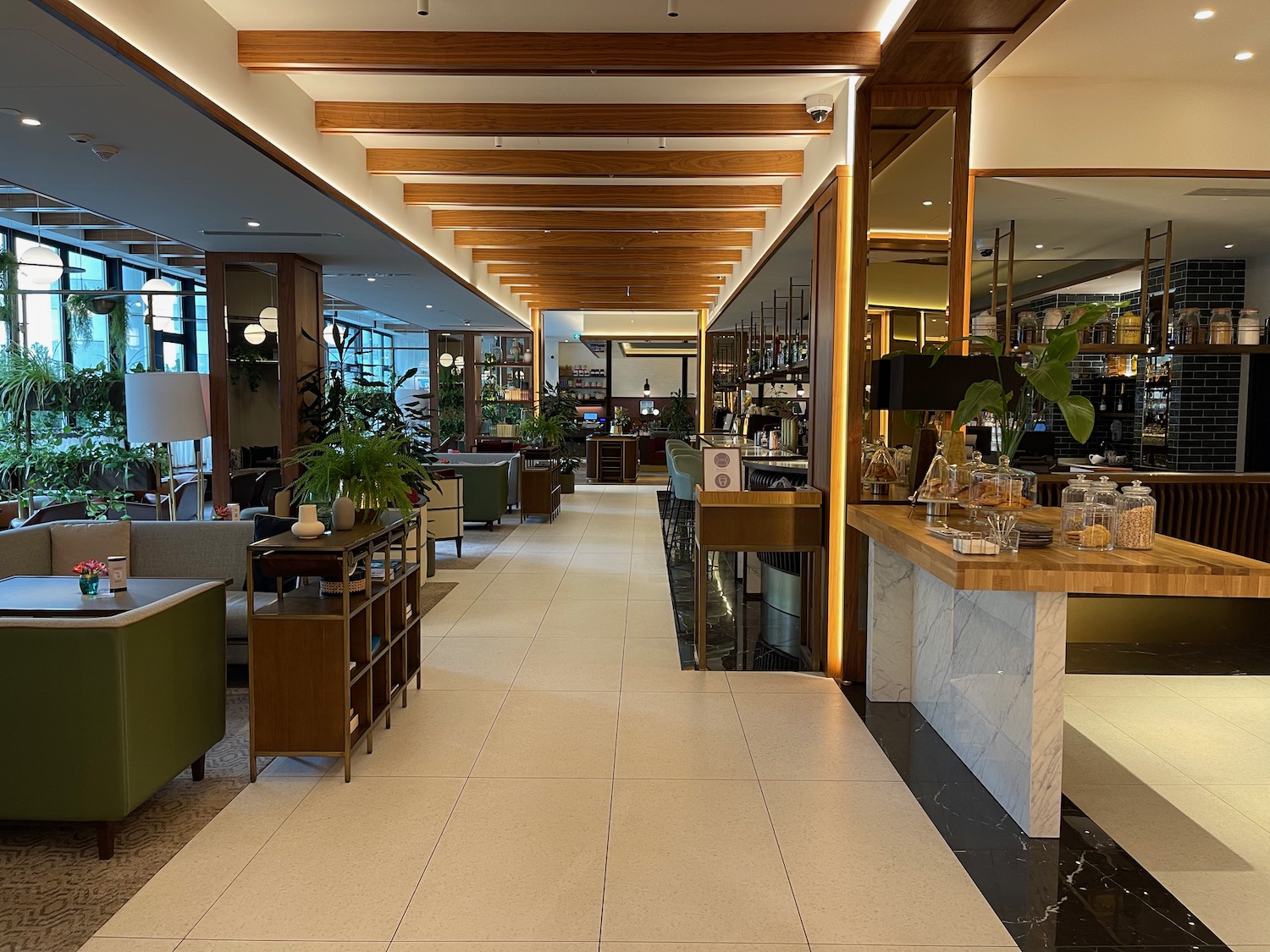 a room with a large counter and a large mirror