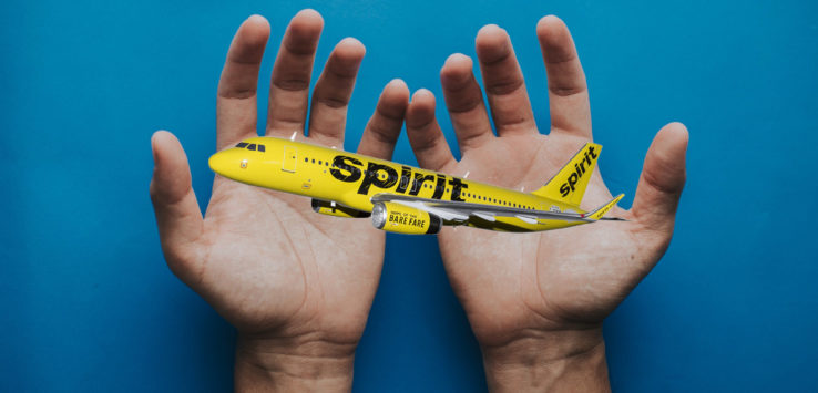 a hand holding a model airplane