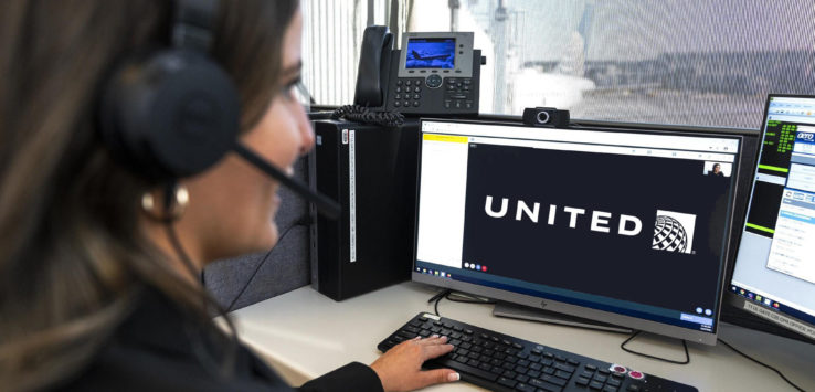 a woman wearing headphones and using a computer