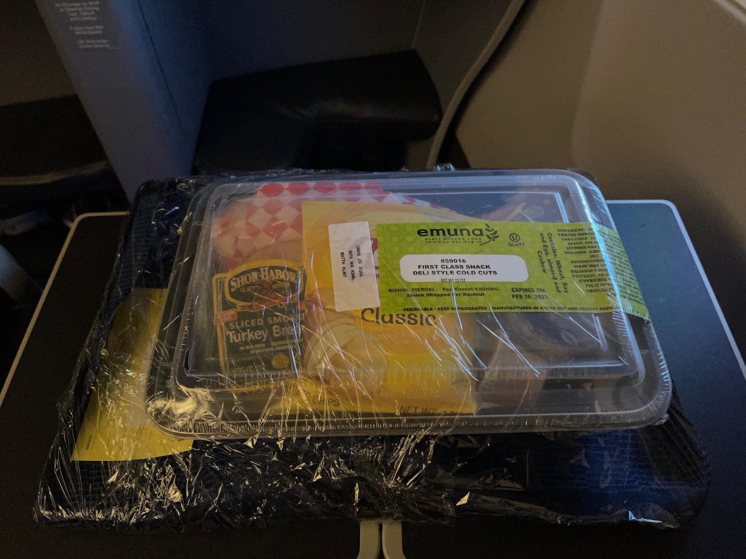 food in a tray on a seat