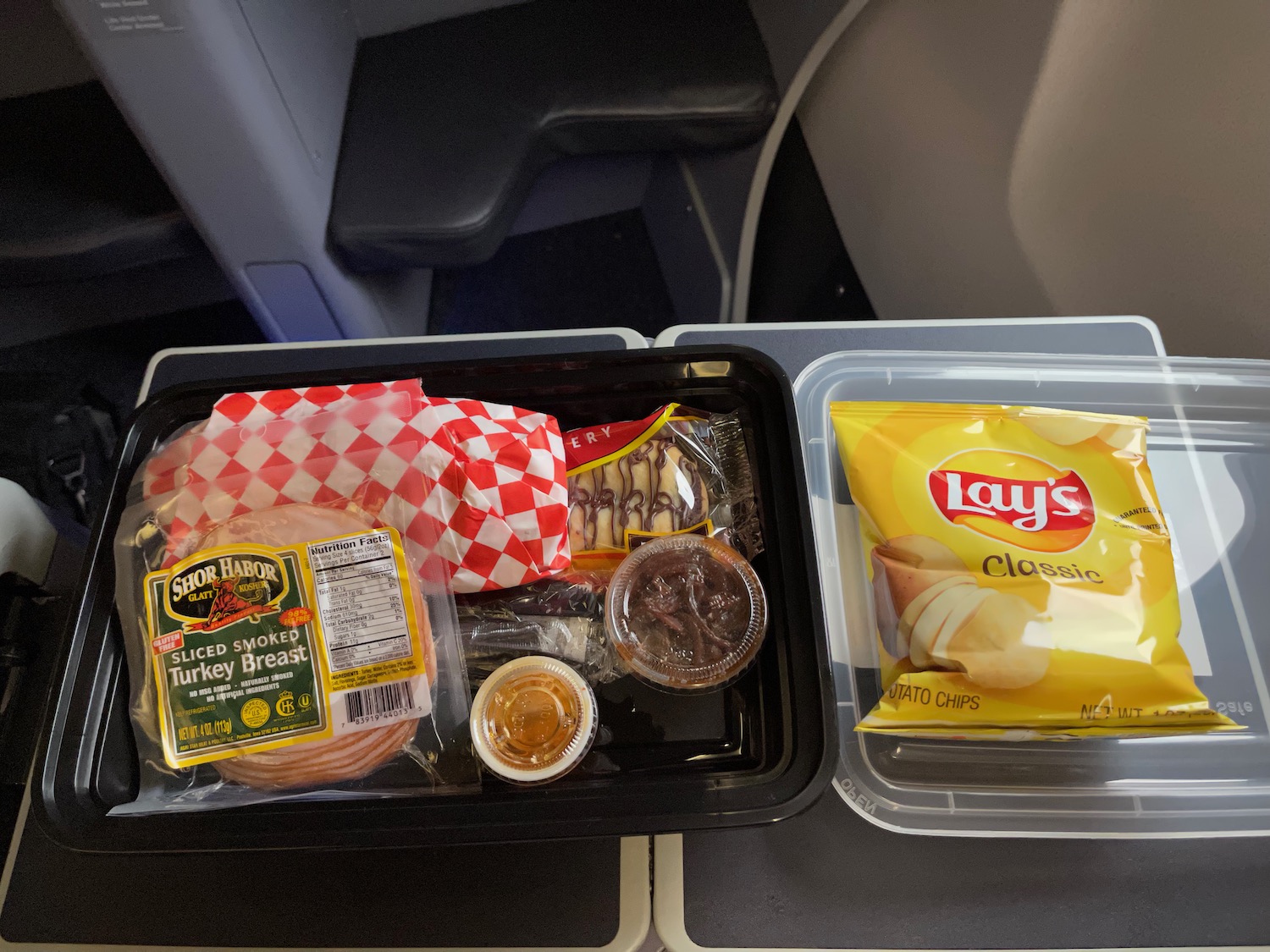 food in a tray on a plane