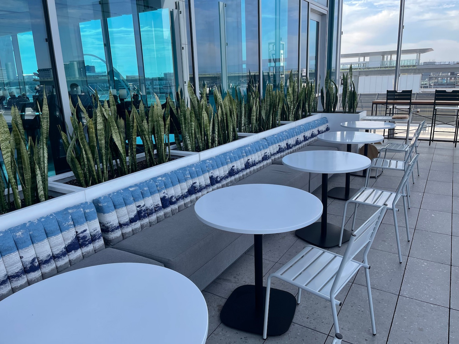 a group of tables and chairs on a patio