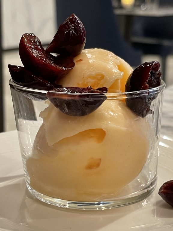 United Polaris dining melon sorbet and Virginian cherries