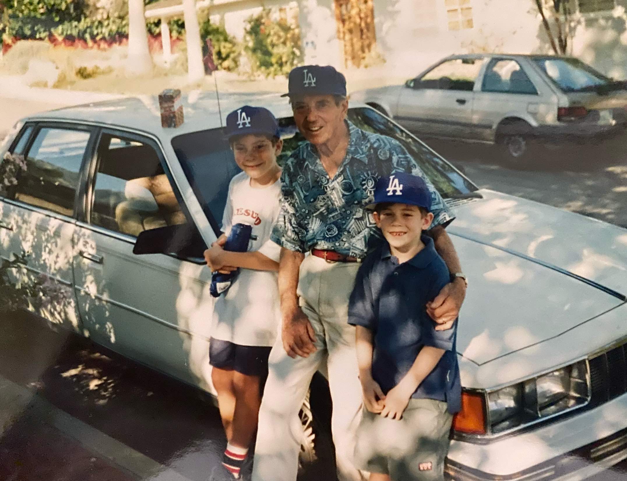 a man and two boys posing for a picture