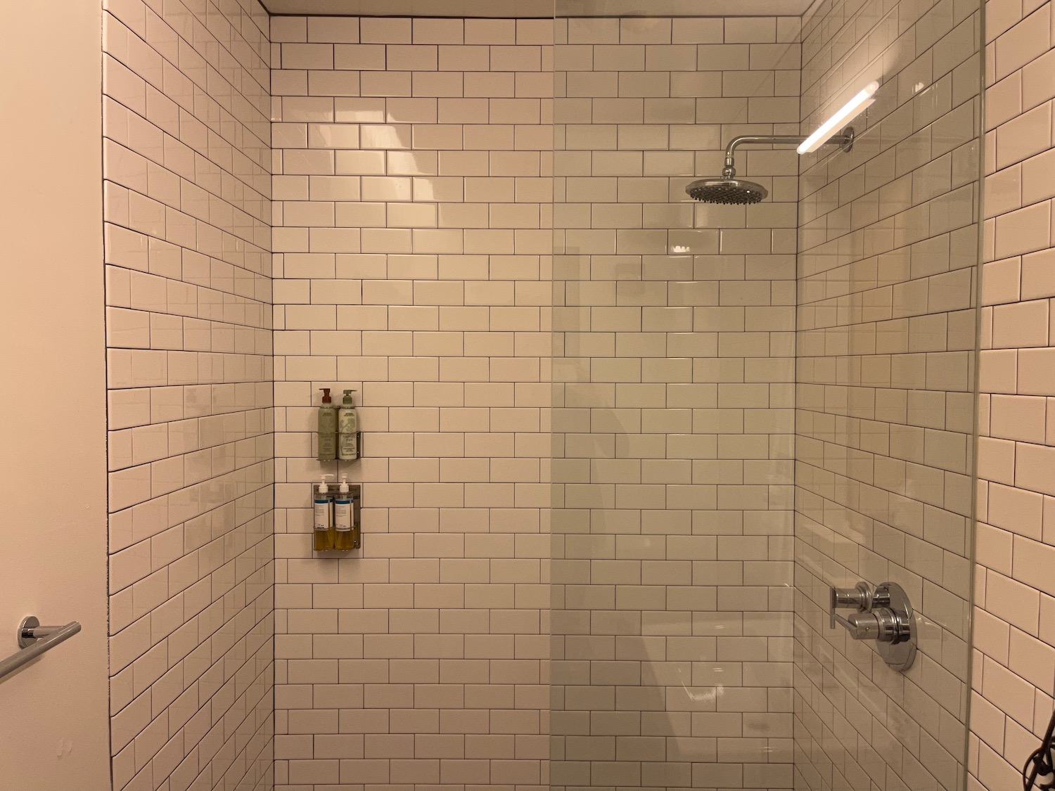 a shower with a shower head and shower head