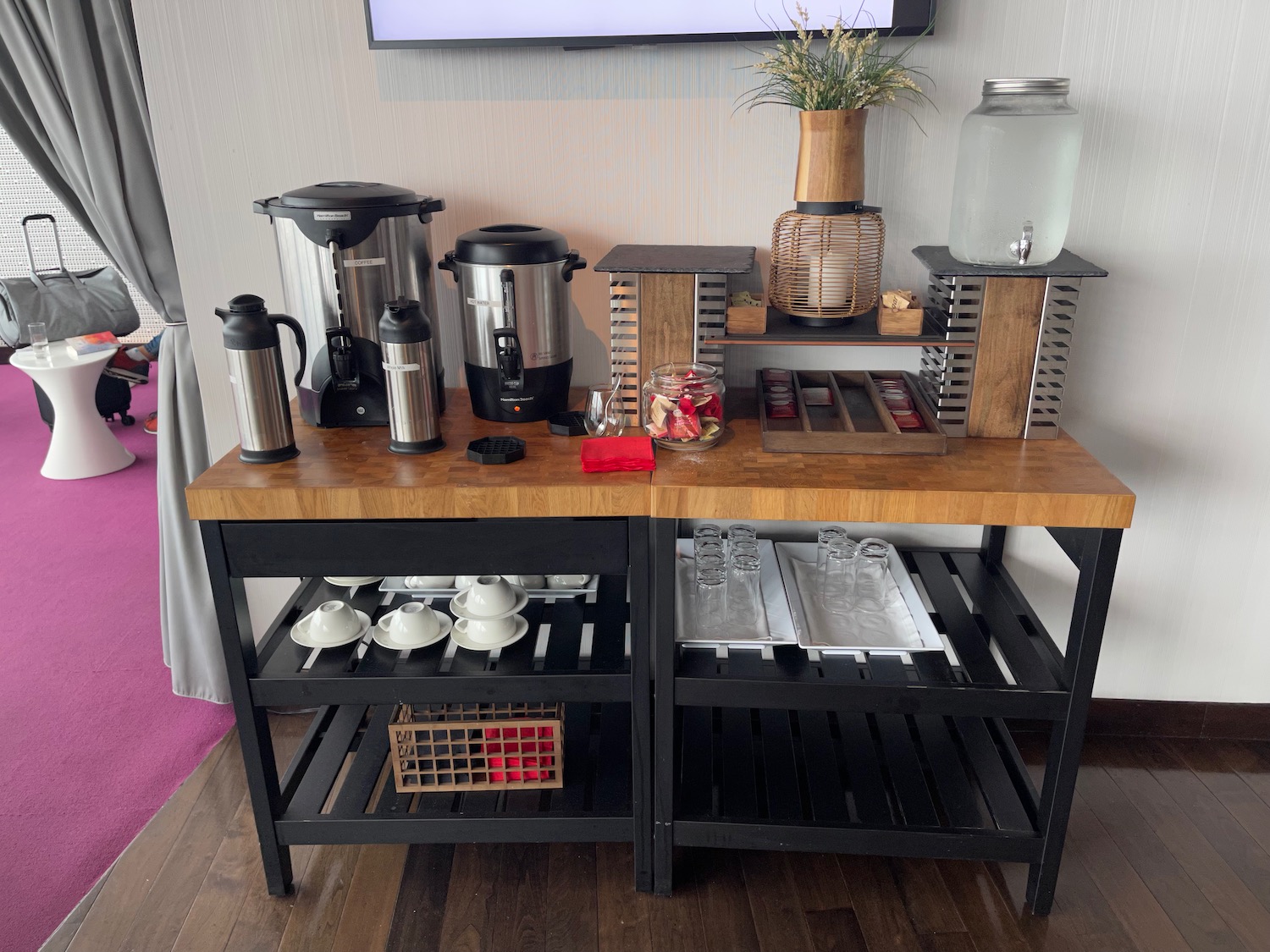 a table with a variety of coffee machines and other items