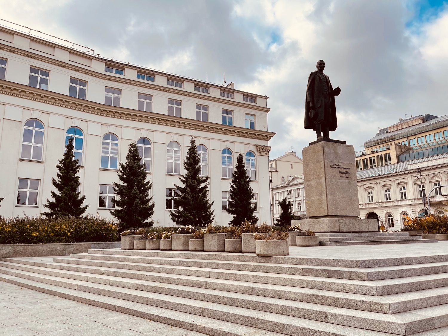 a statue of a man in front of a building