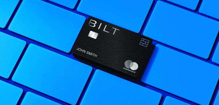 a black credit card on a blue keyboard