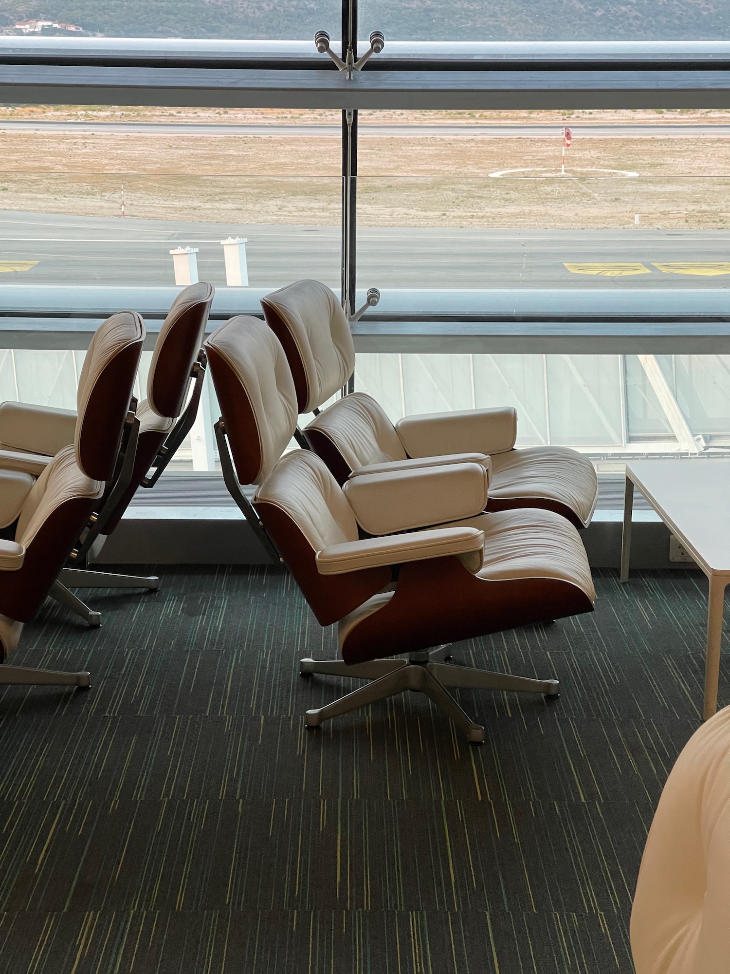 a group of chairs in a room with a window