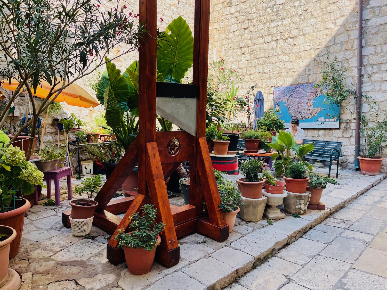 a wooden structure with plants in pots