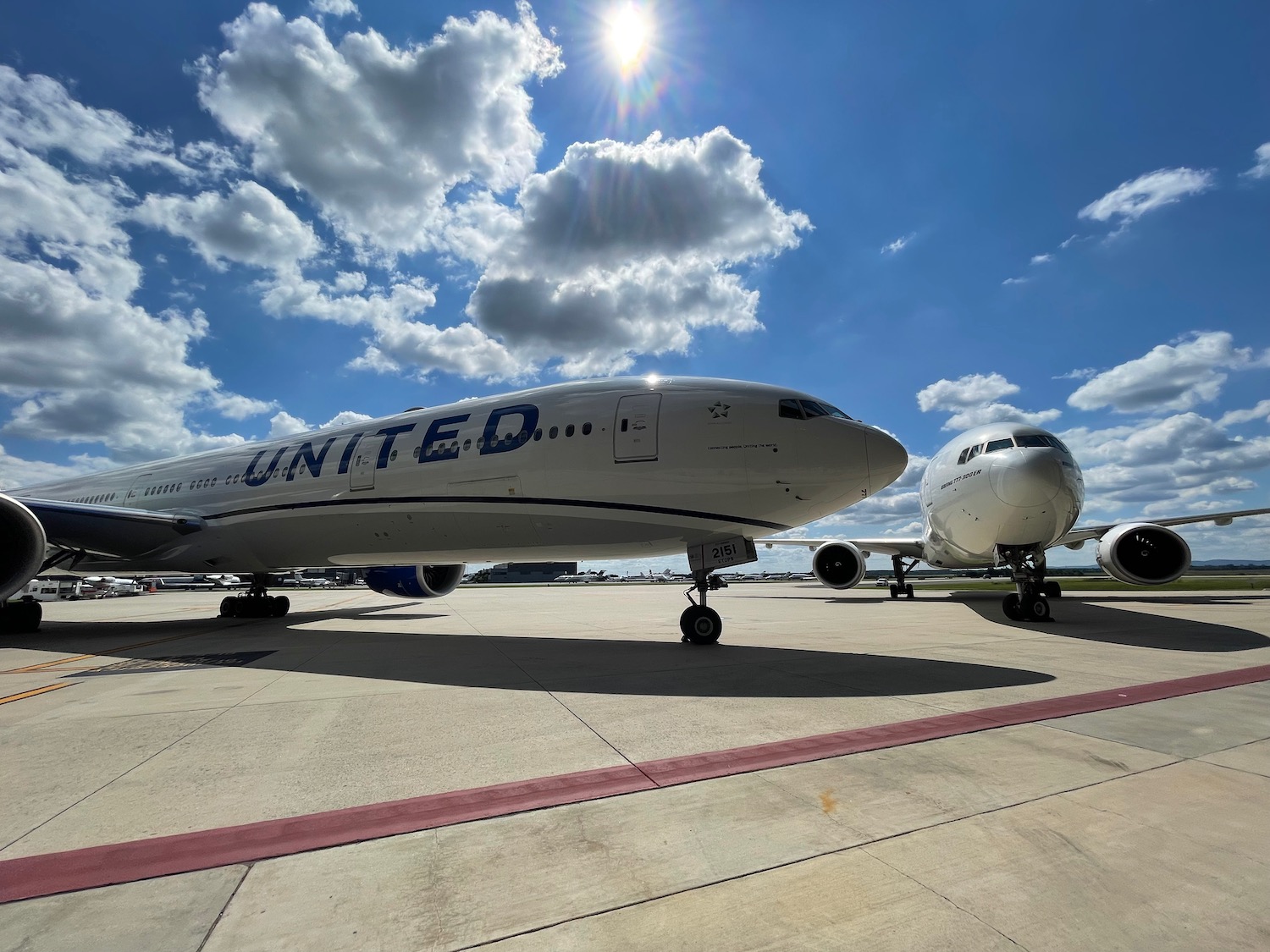 a group of airplanes on a runway