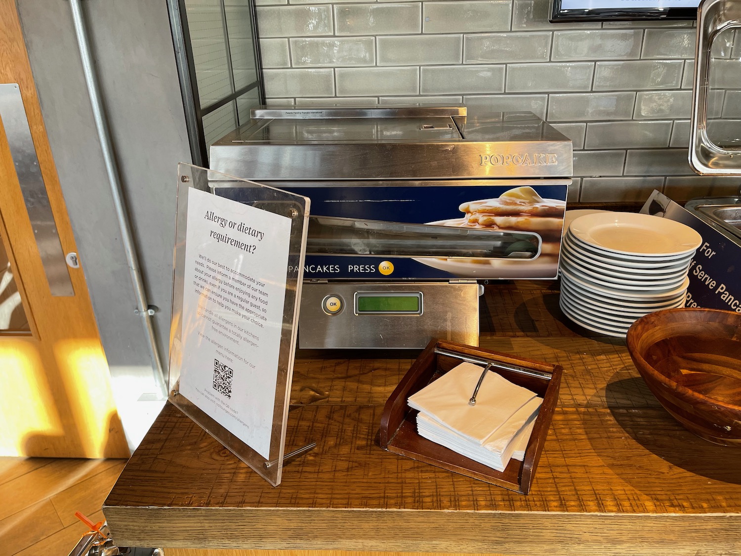 a table with plates and a sign on it