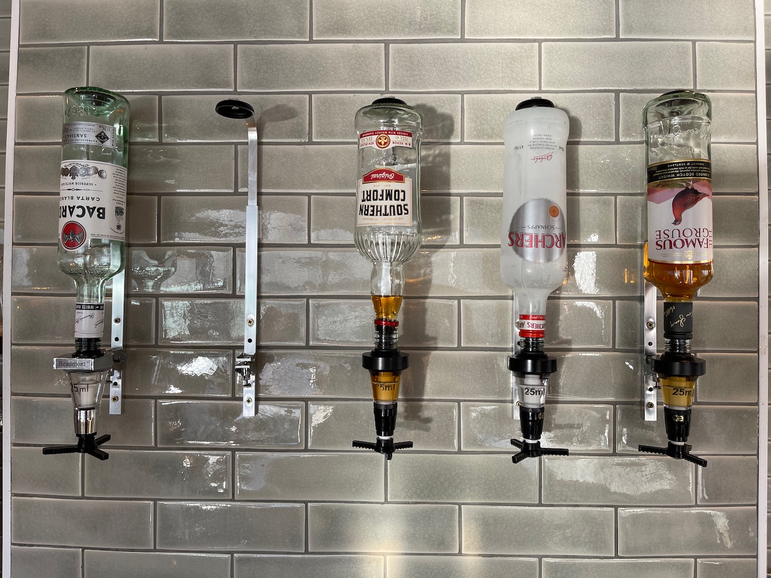 a row of bottles on a wall