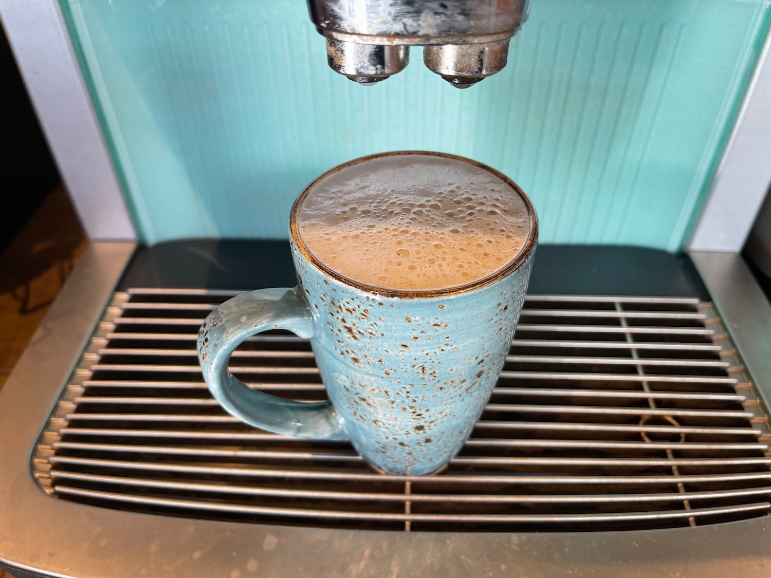 a coffee machine with a cup of coffee