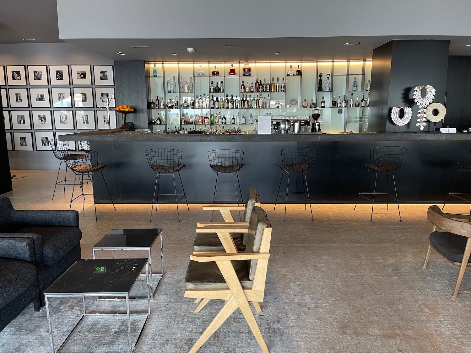 a bar with chairs and a table