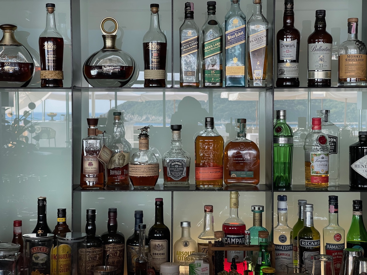 a shelf full of liquor