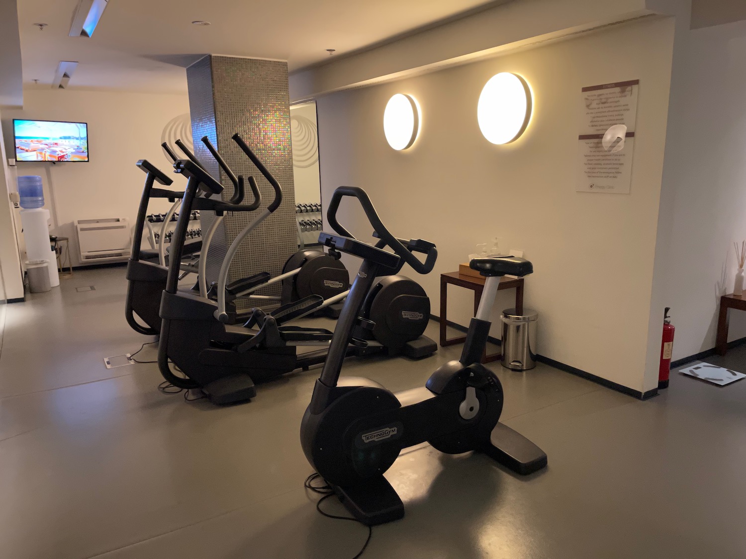 a group of exercise machines in a room