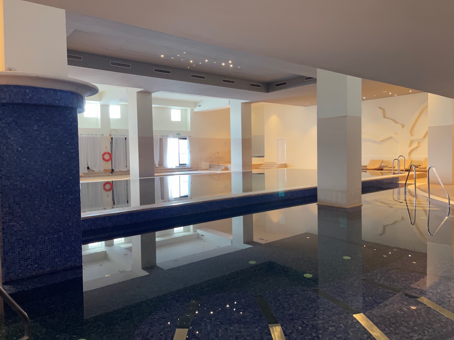 a large indoor pool with a large pool