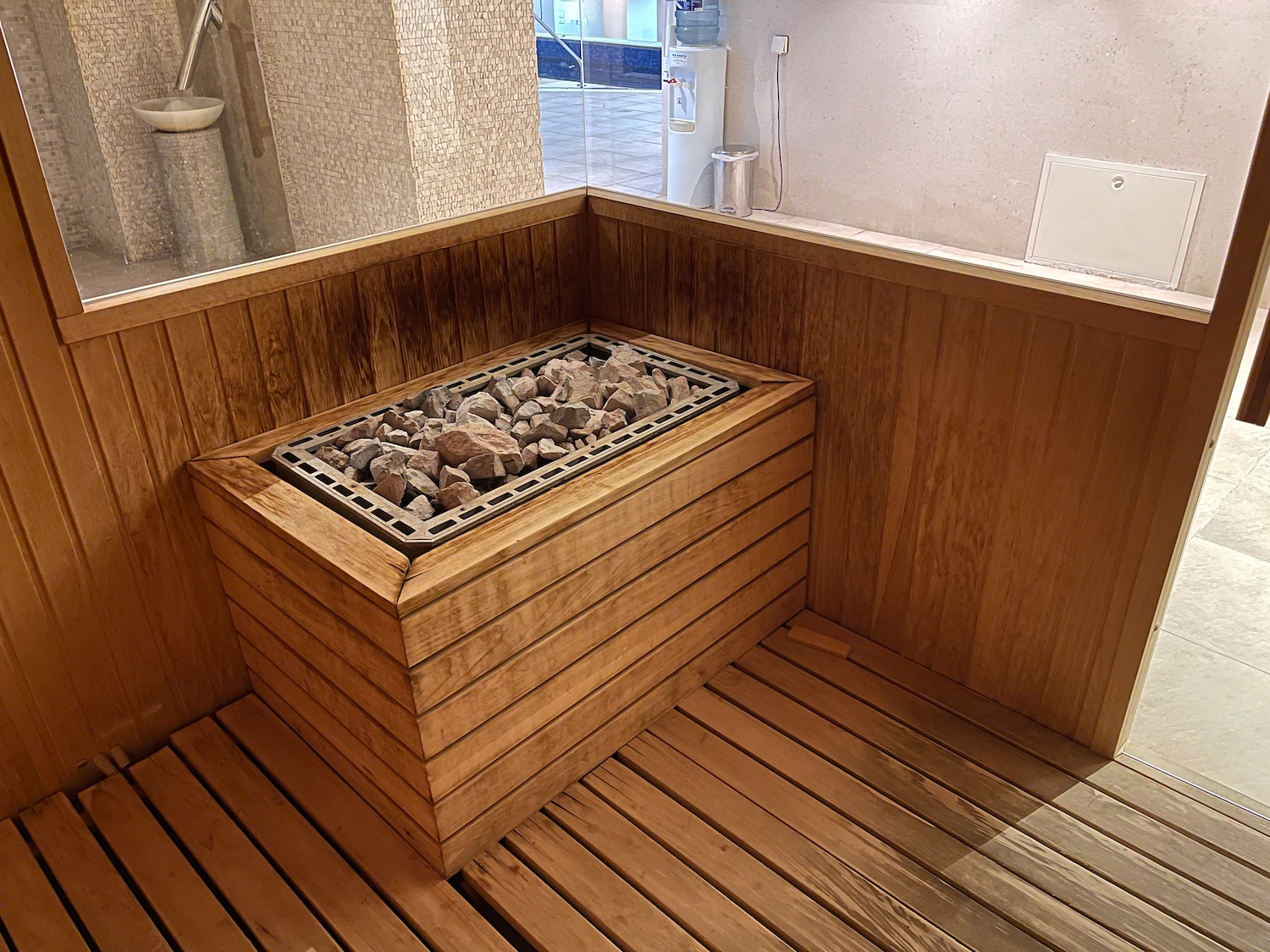 a wooden sauna with rocks in it