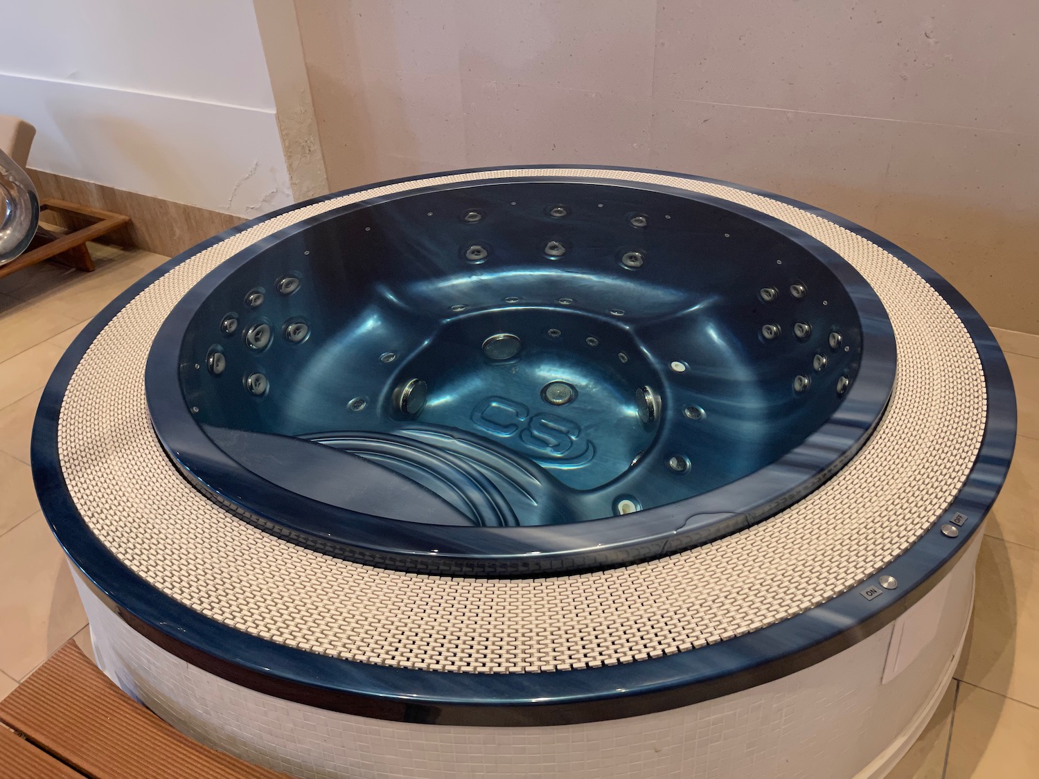 a round hot tub with a wicker surface