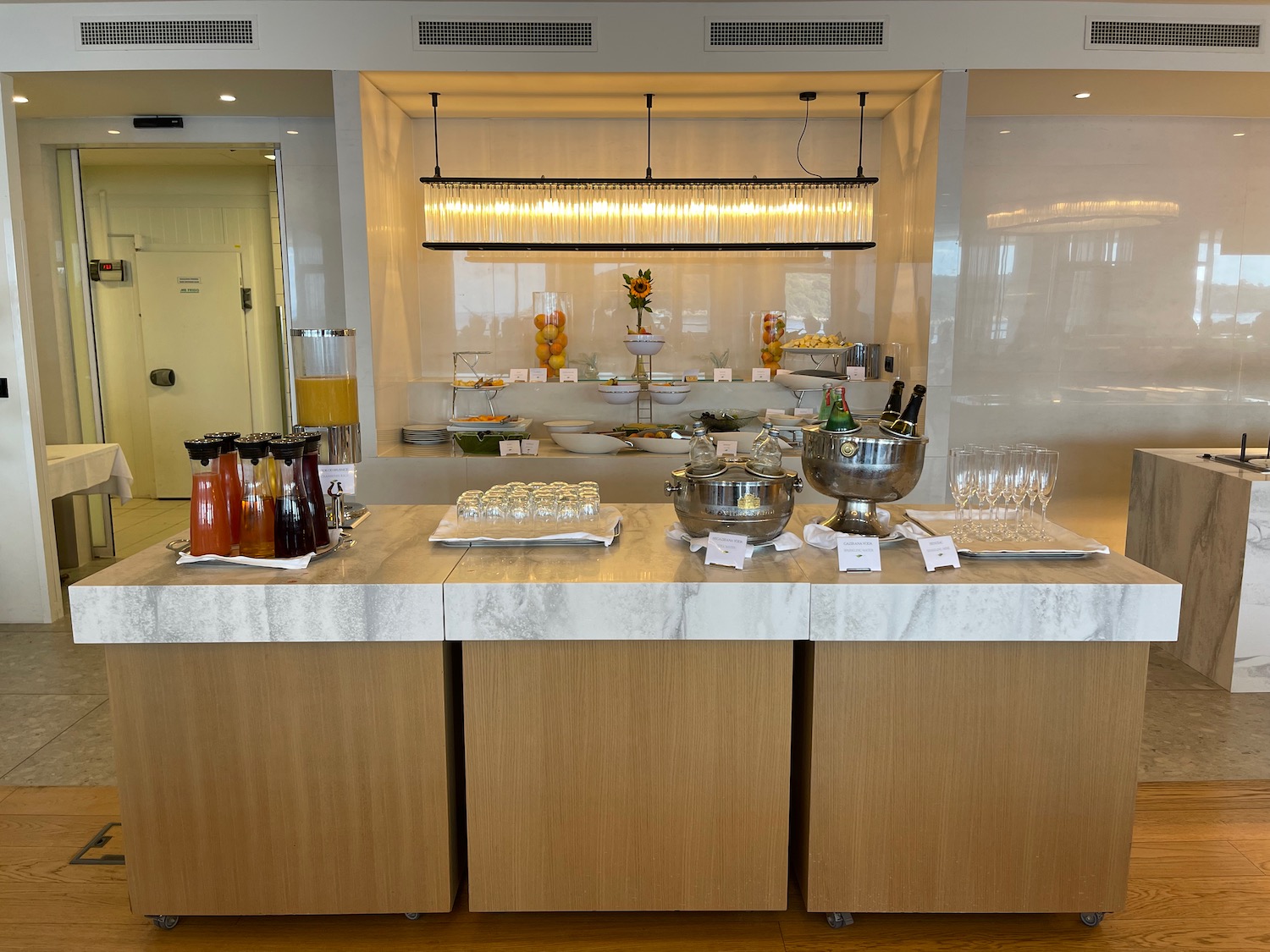 a buffet table with drinks and glasses