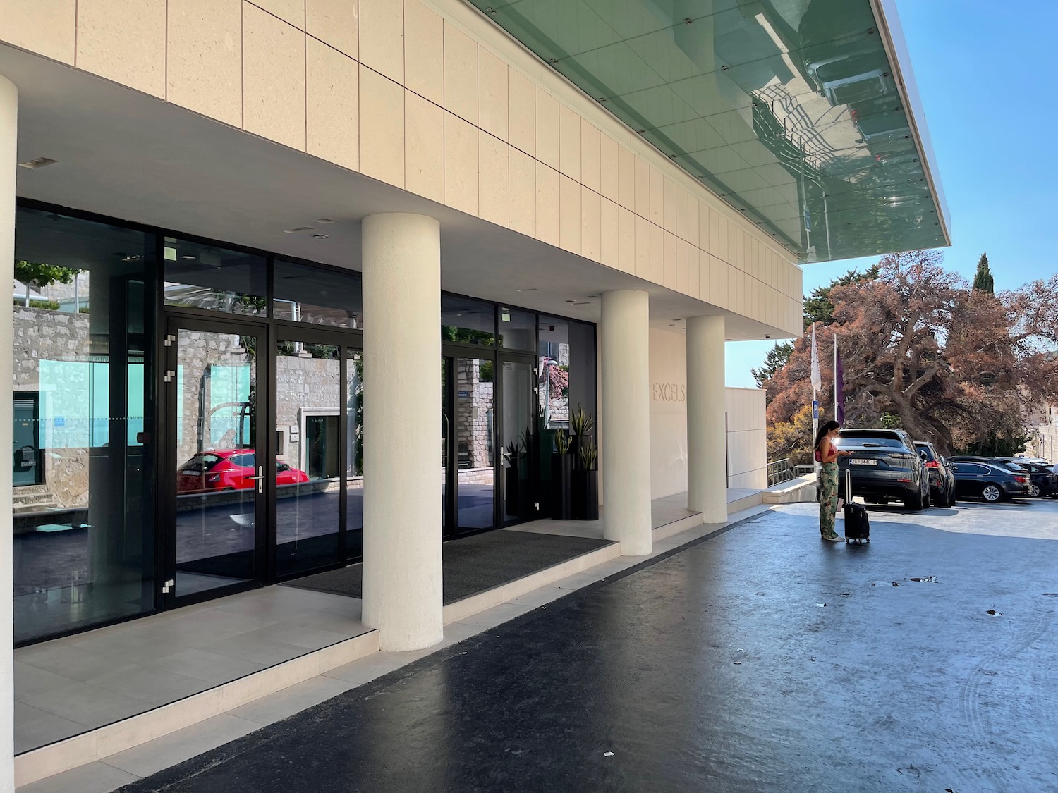 a woman standing outside of a building