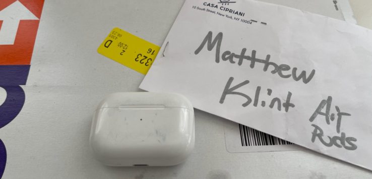 a white box with a tag on it