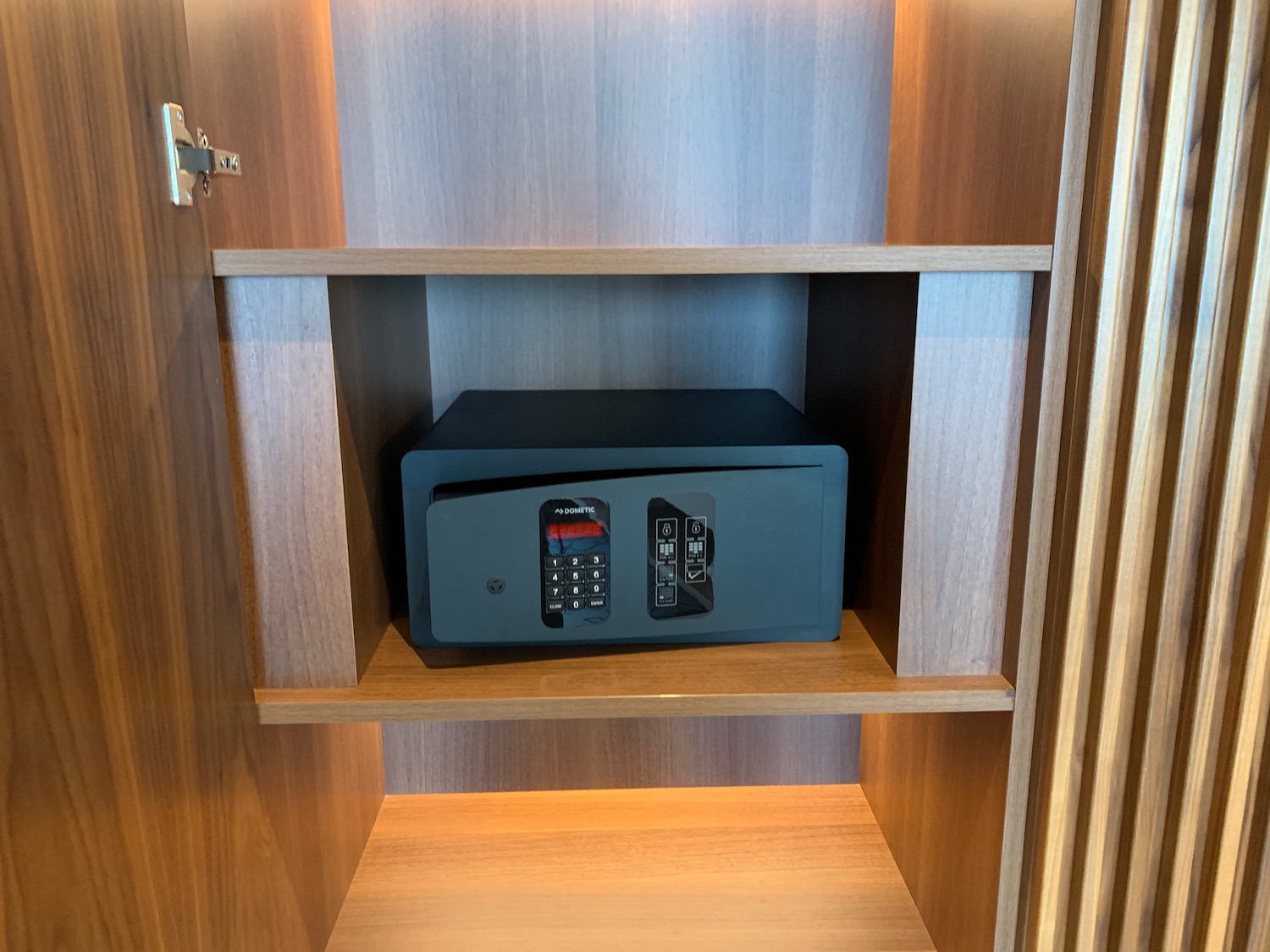 a safe in a wooden shelf