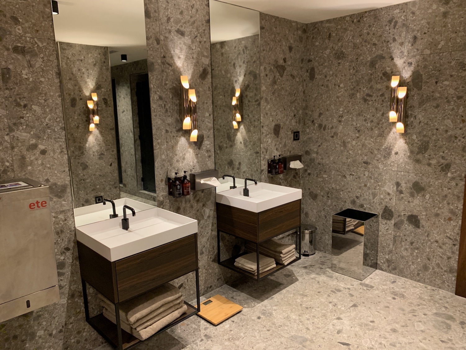 a bathroom with a large mirror and sinks