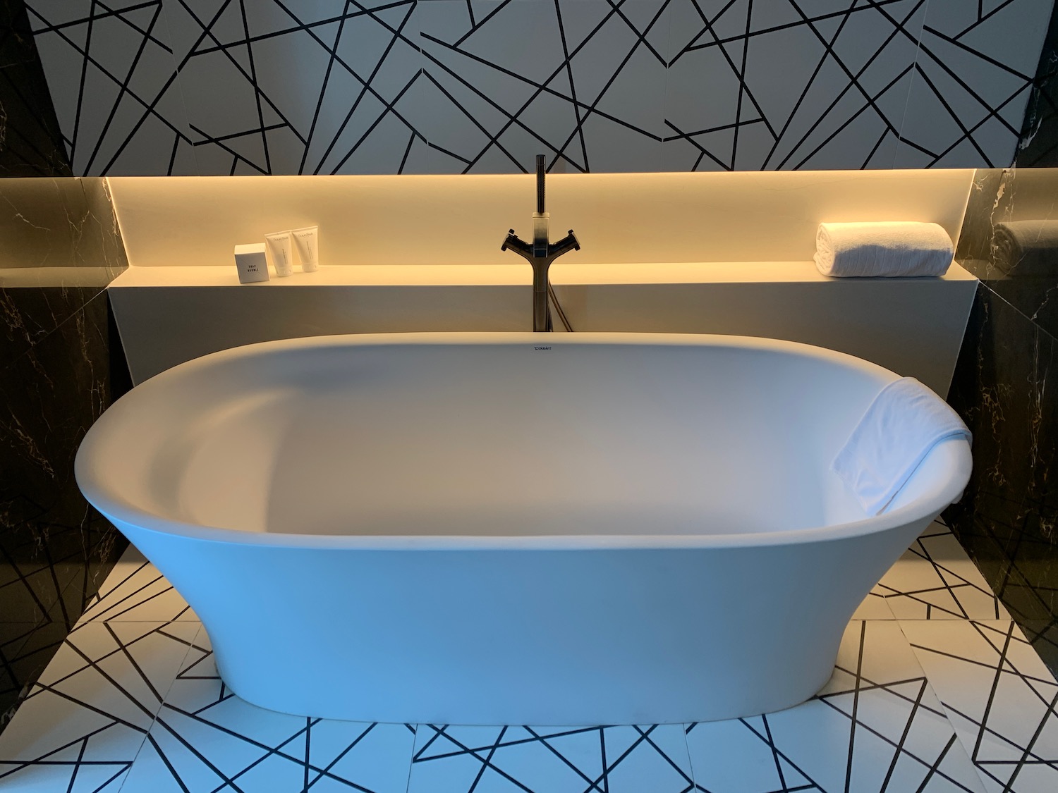 a white bathtub in a bathroom