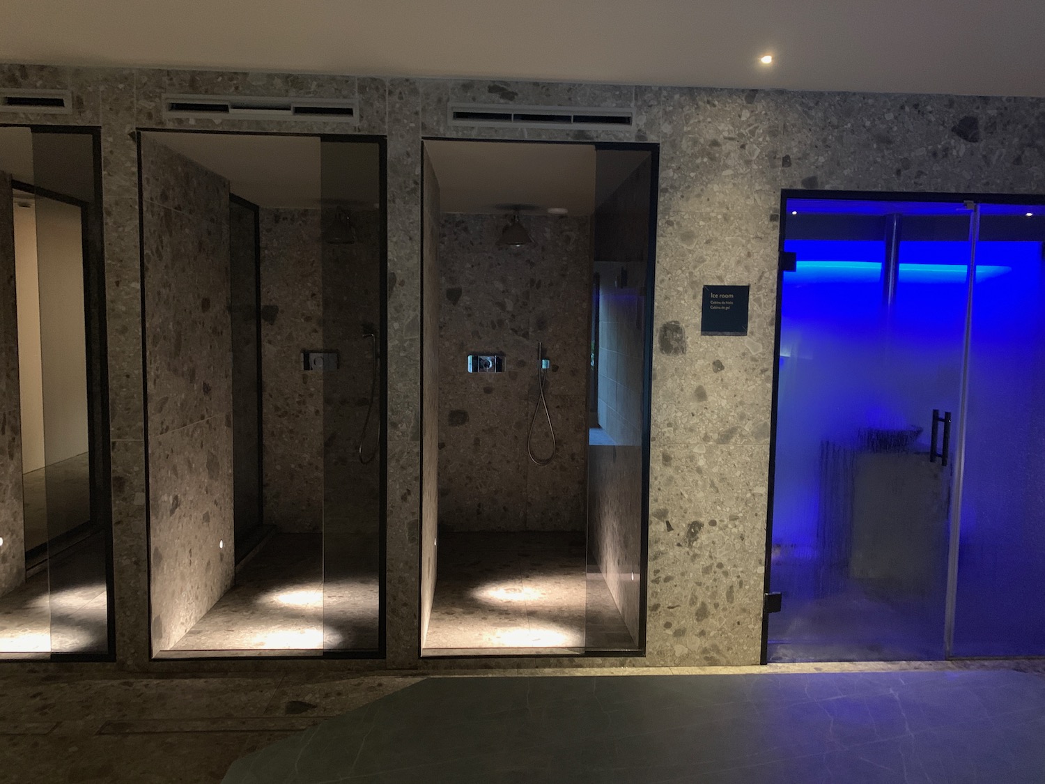 a shower room with glass doors