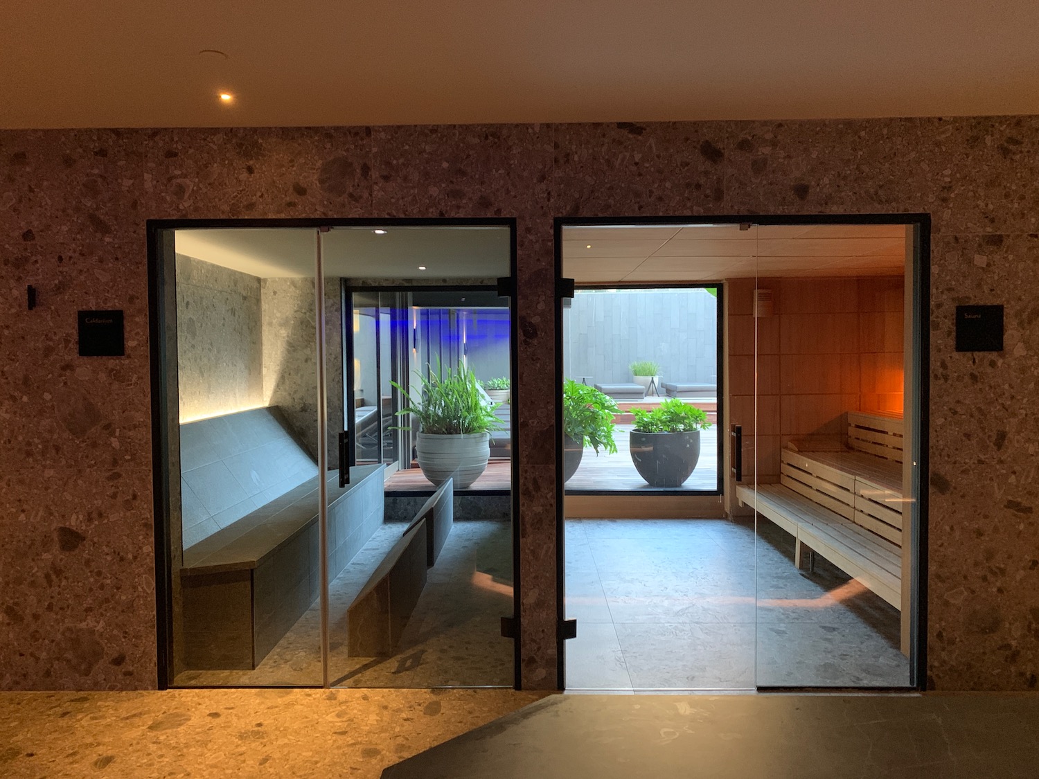 a glass doors leading to a sauna