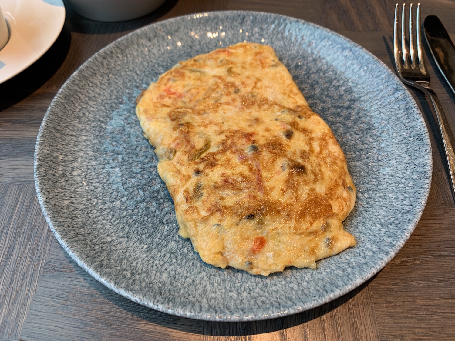 a plate of omelette on a table