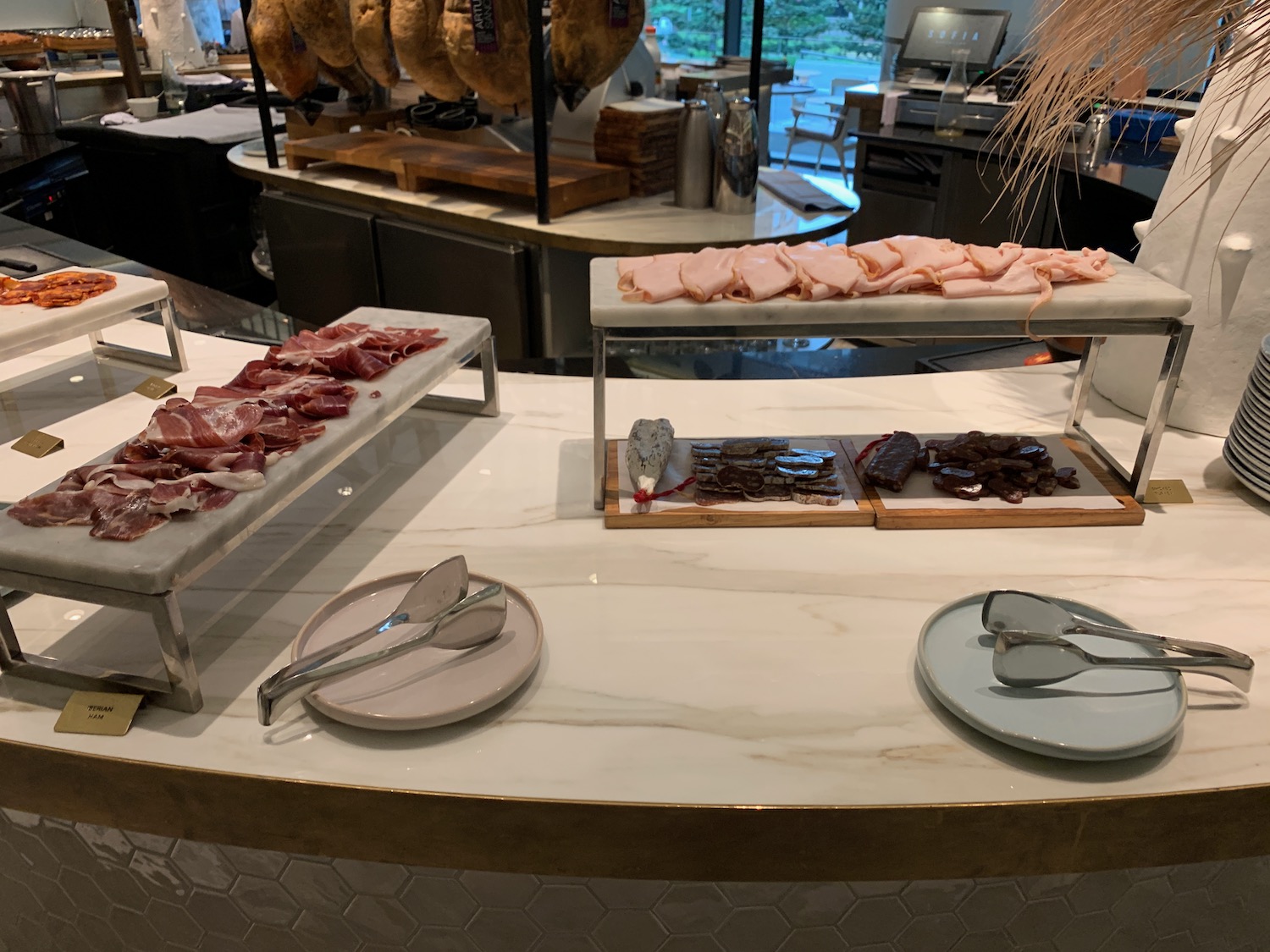 a counter with different types of meat on it